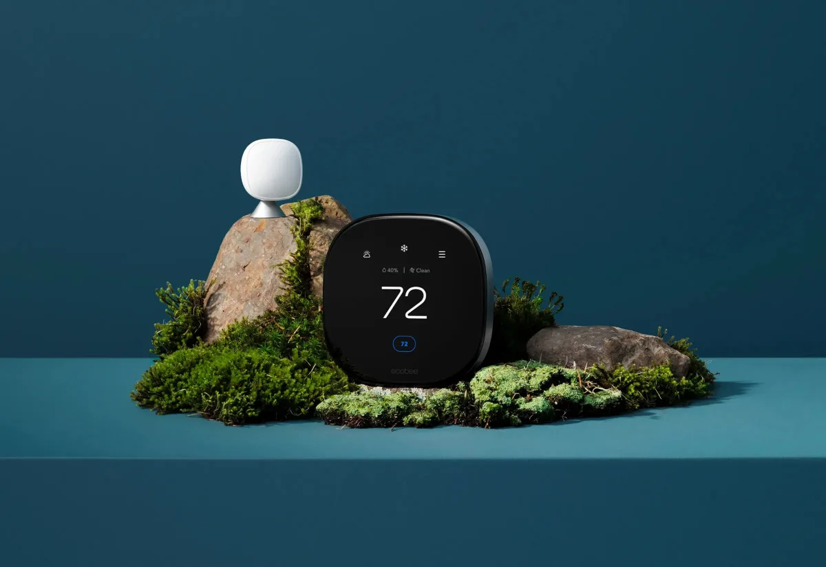 Smart thermostat mounted on a living room wall